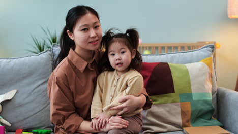 woman with her baby in living room