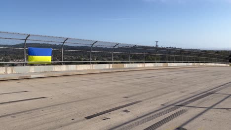 ukraine flag on empty overpass wide shot