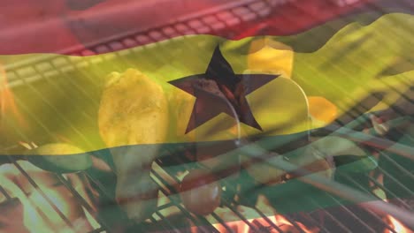 Animation-of-ghana-flag-waving-over-chicken-wings,-tomatoes,-vegetables-cooking-on-barbecue-grill