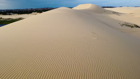 Unique-patterns-in-touristic-white-sand-dunes-of-Mui-Ne,-Vietnam