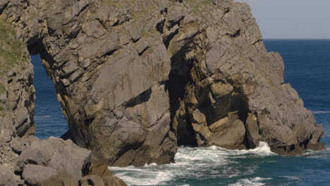 still shot of a rock structure at the gaztelugatxe area