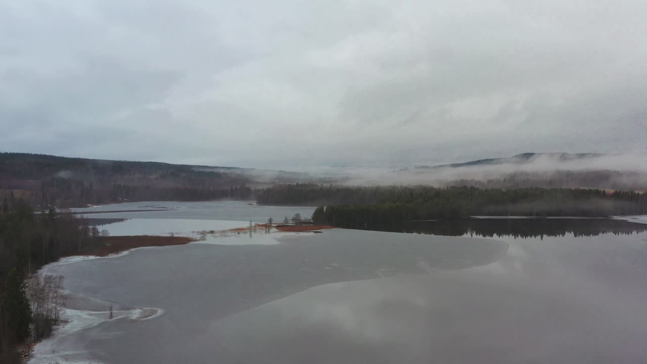 Aerial shot of a Swedish landscape at the start of the winter