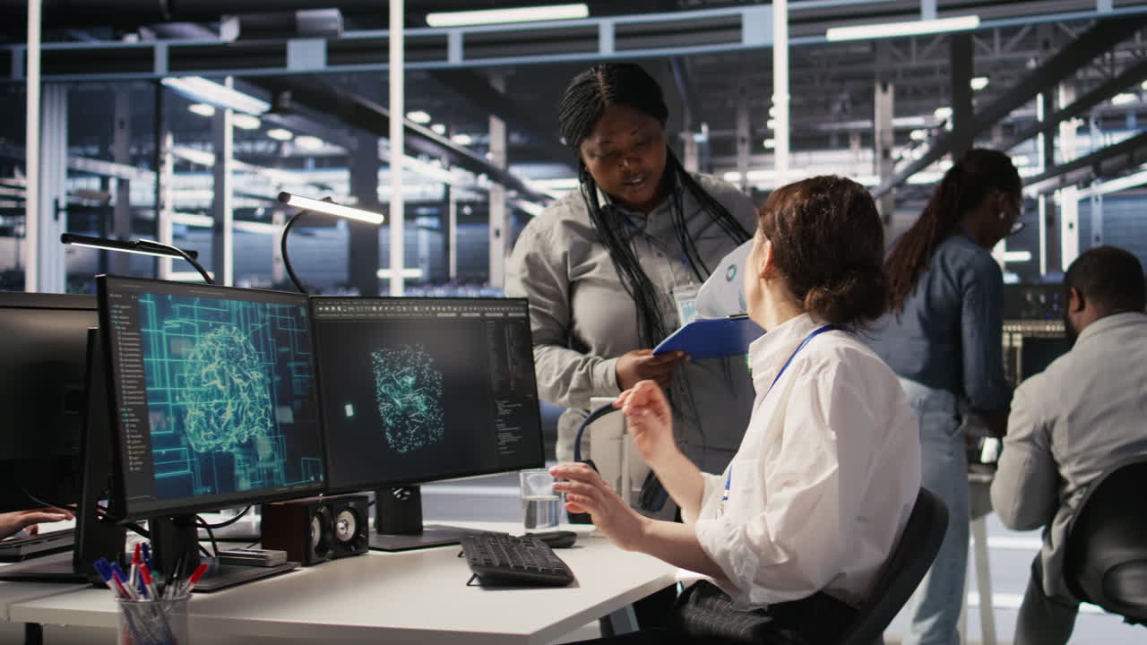 Vertical video Data center software developer using PC to monitor neural networks