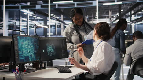 vertical video data center software developer using pc to monitor neural networks