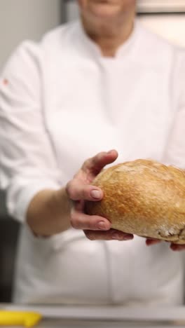 chef holding slices of freshly baked bread