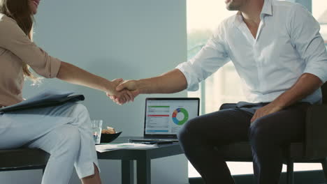 business people shaking hands. closeup handshaking in private house.