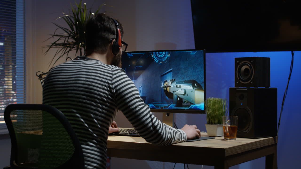 Man Playing a First-Person Shooter Game