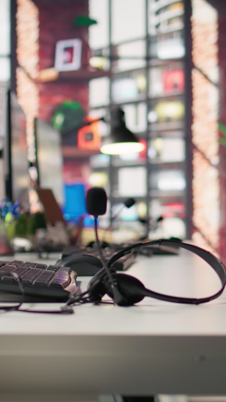 Vertical video Headphones with microphone on call center office desk