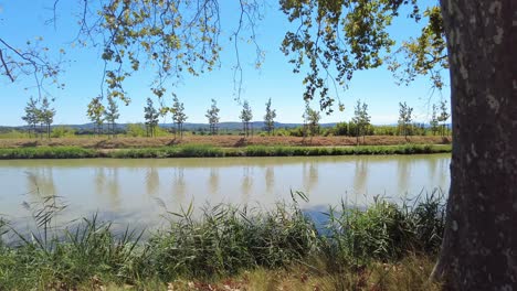 canal du midi le somail france sheltering from the mid day sun on a warm september morning