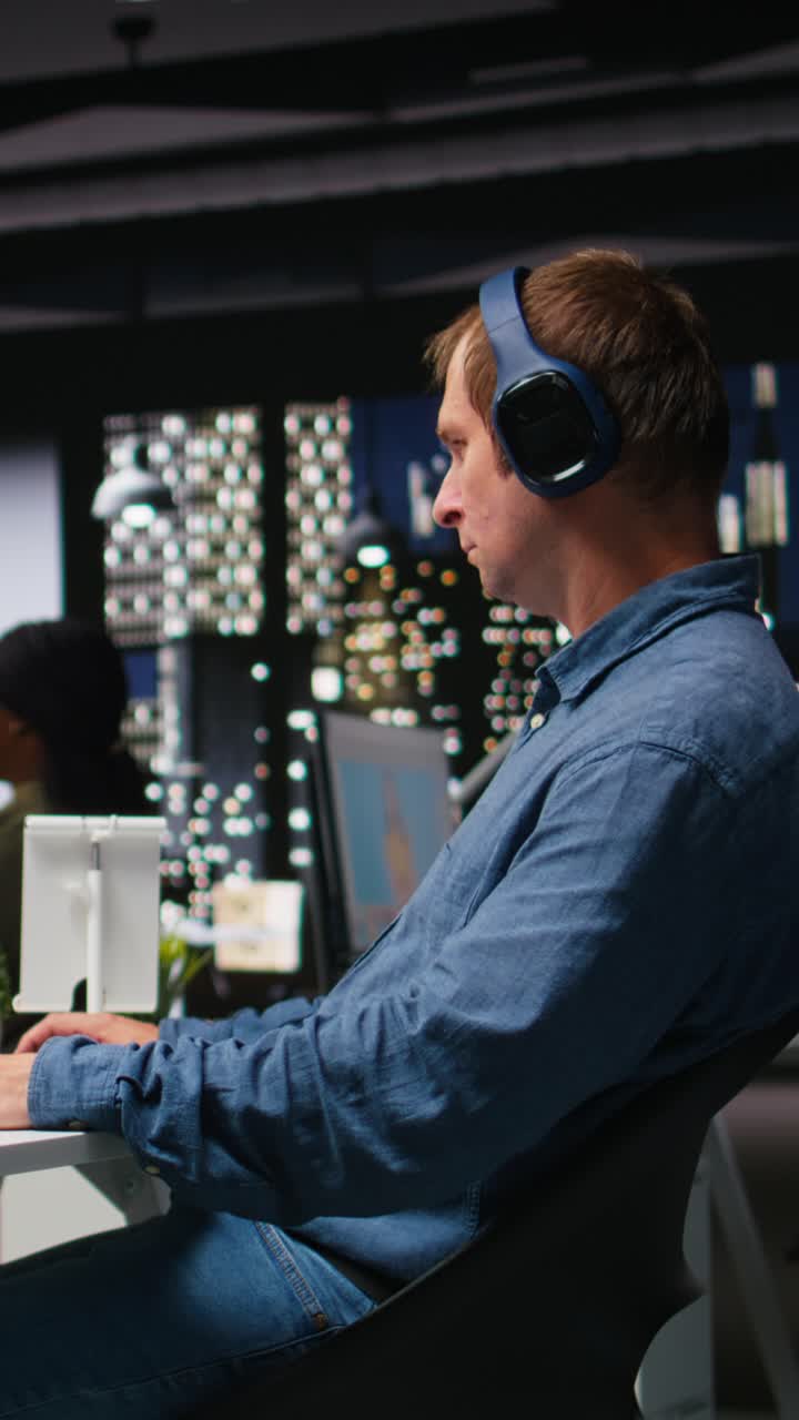 Vertical Video Graphic developer working with photo editing software at the office
