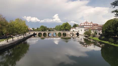 still shot of the roman bridge over the tamega river canal in chaves, portugal