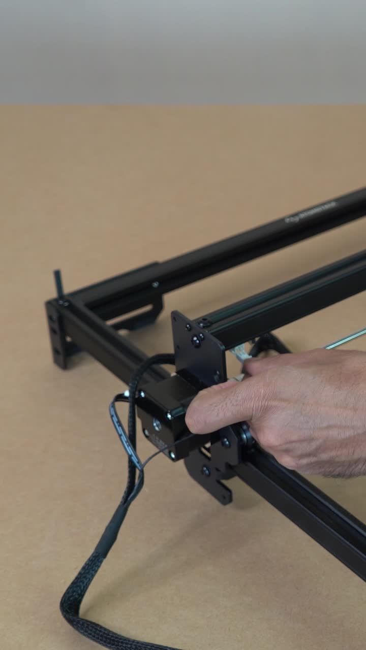 Hand connects Micro JST 2 Pin cable to machine with precision