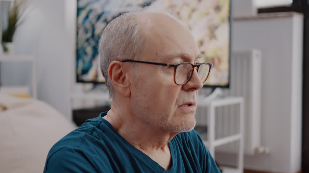 Close up of senior man doing wellness exercise and breathing