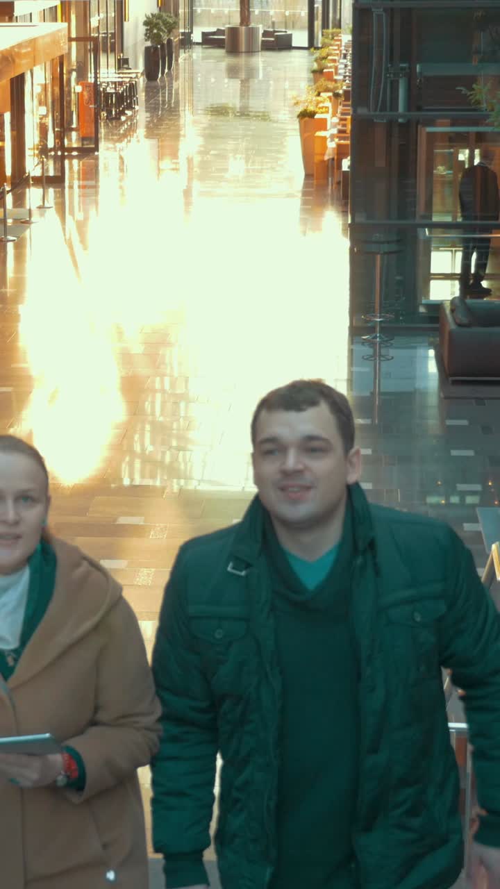 People Walking in a Brightly Lit Interior