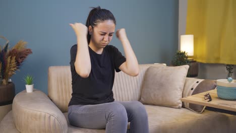 young woman slapping herself with a nervous breakdown.