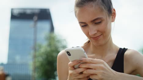 close up video of young woman with smart phone outdoors