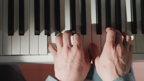 close-up shot capturing hands skillfully playing a piano, emphasizing the precise movement and interaction with black and white keys