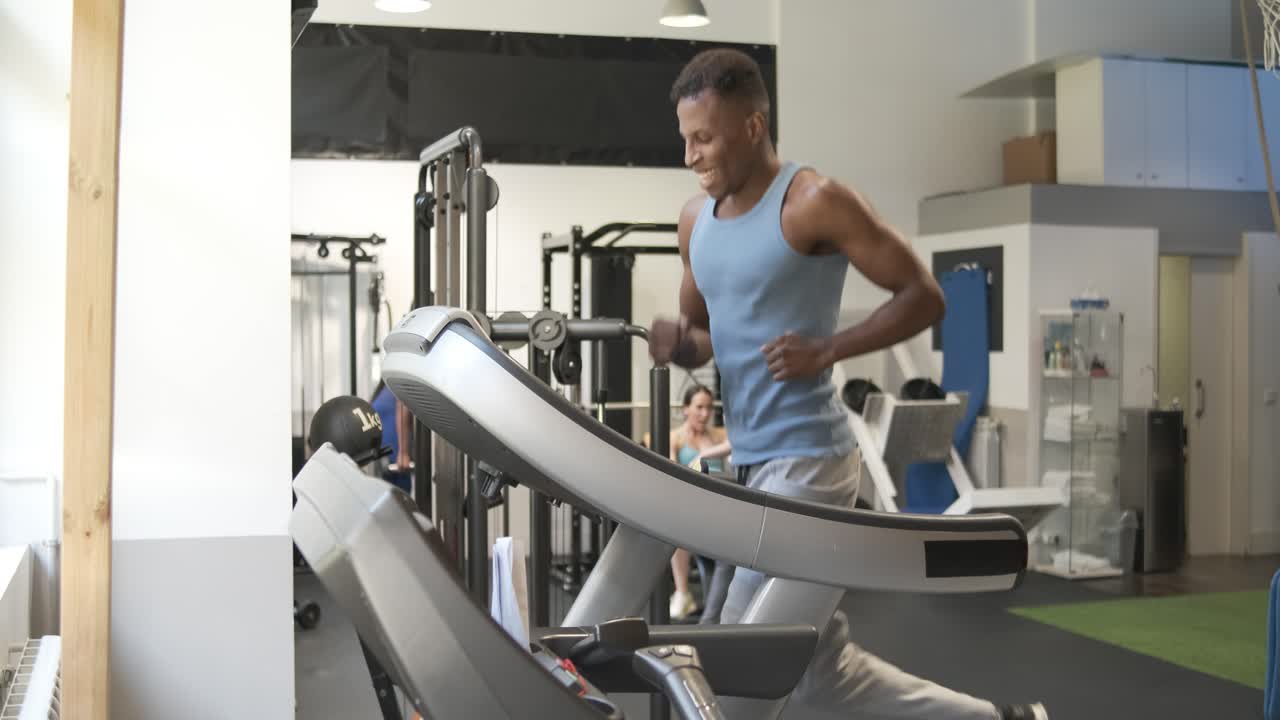 Man Exercising on Treadmill in Gym