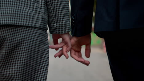 teenage boy and girl holding hands