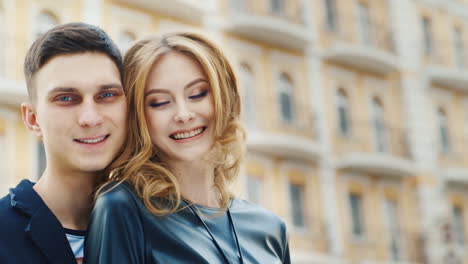 Man-And-Woman-Smiling-Looking-At-The-Camera-In-The-Background-Is-A-Little-Blurred-Video-Multi-Storey