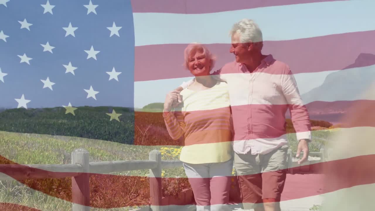 animación de una feliz pareja caucásica de alto nivel abrazándose en la playa sobre la bandera de los estados unidos de américa