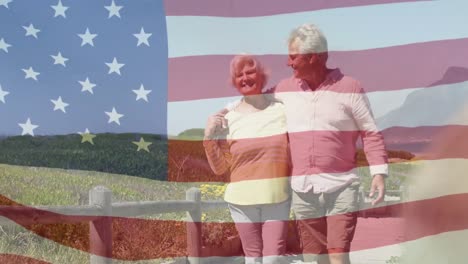 Animation-of-happy-senior-caucasian-couple-embracing-on-beach-over-flag-of-united-states-of-america