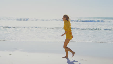 Side-view-of-young-Caucasian-woman-running-on-the-beach-4k