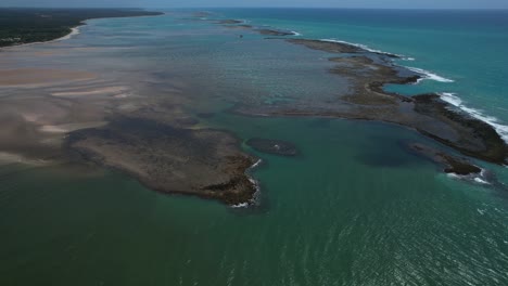 flying over the beach of são miguel dos milagres beach in the state of alagoas, brazil.