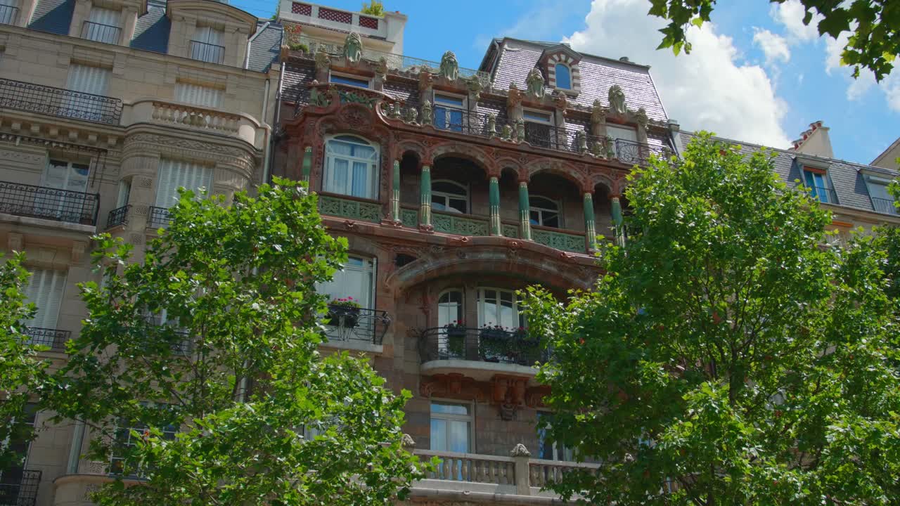 Remarkable Facade Of Lavirotte Building At 29 Avenue Rapp, 7th Arrondissement Of Paris. Art Nouveau Architecture In France. low angle, slider right