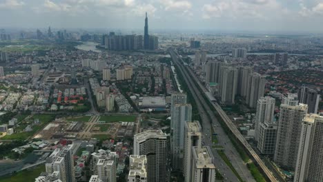 Camera-tilts-up-from-luxury-high-rise-buildings-and-freeway-to-reveal-epic-city-skyline-and-river-landscape