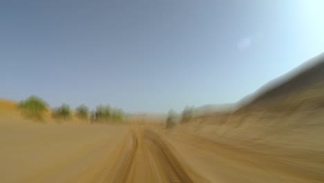 pov camera car in the sahara desert off road driving seamless loop motion blure