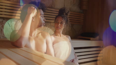 relaxing in sauna, couple surrounded by warm light bokeh animation