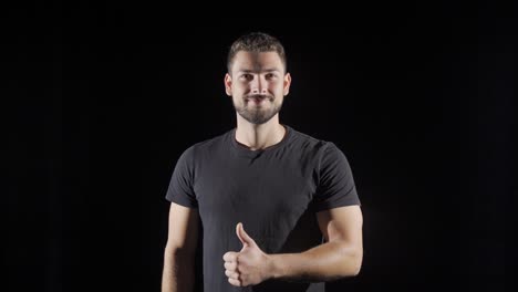 Sportsman-young-man-smiling-and-looking-at-camera.