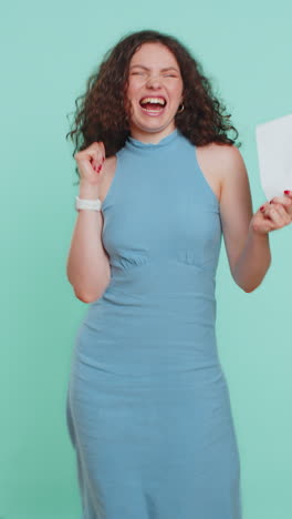 happy young woman open envelope take out letter reads bank loan approve great news award win