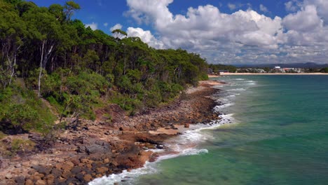 fly by rocky shoreline of noosa national park near noosa heads in queensland, australia