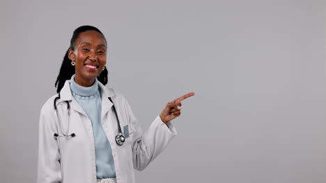 Black-woman,-doctor-and-pointing-to-mockup-space
