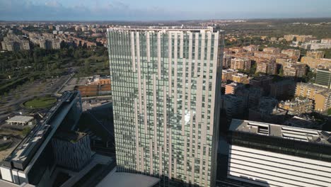 aerial boom shot above europarco tower in rome, italy