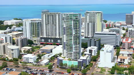 aerial drone of city with ocean view apartment buildings along coastline of darwin nt australia