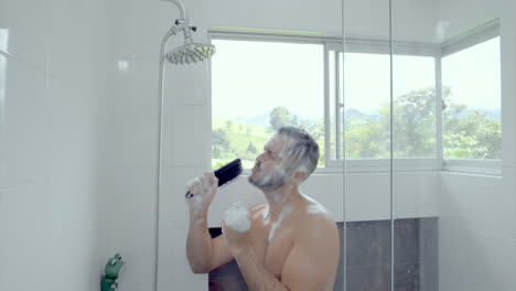 man singing and dancing and singing in the shower while puting shampoo on his hair
