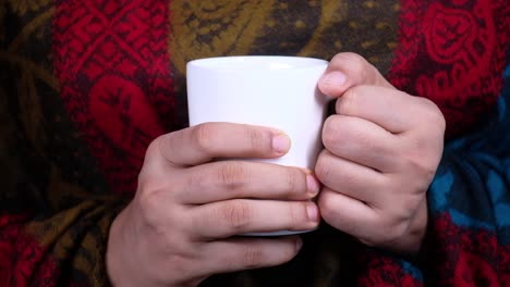 person holding a cup