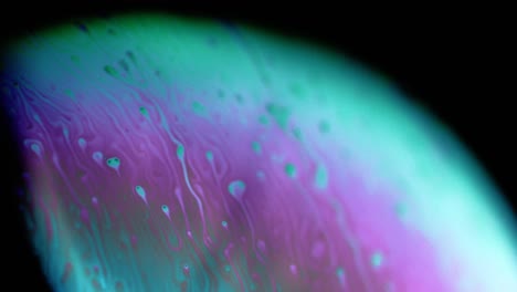 4k stable shots of soap balloons showing the colors of the macro world through a microscope perspective