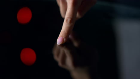 Female-finger-moving-air-over-table.Macro-finger-touching-glossy-surface.