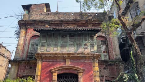 low angle shot of abandoned haunted zamindar building in bengal during daytime.