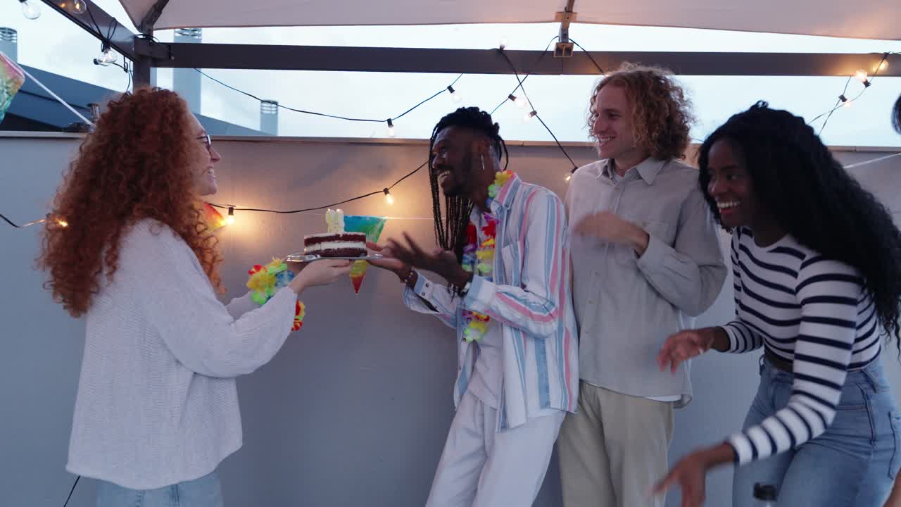 Friends celebrating a birthday with cake and joy