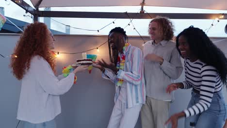 friends celebrating a birthday with cake and joy