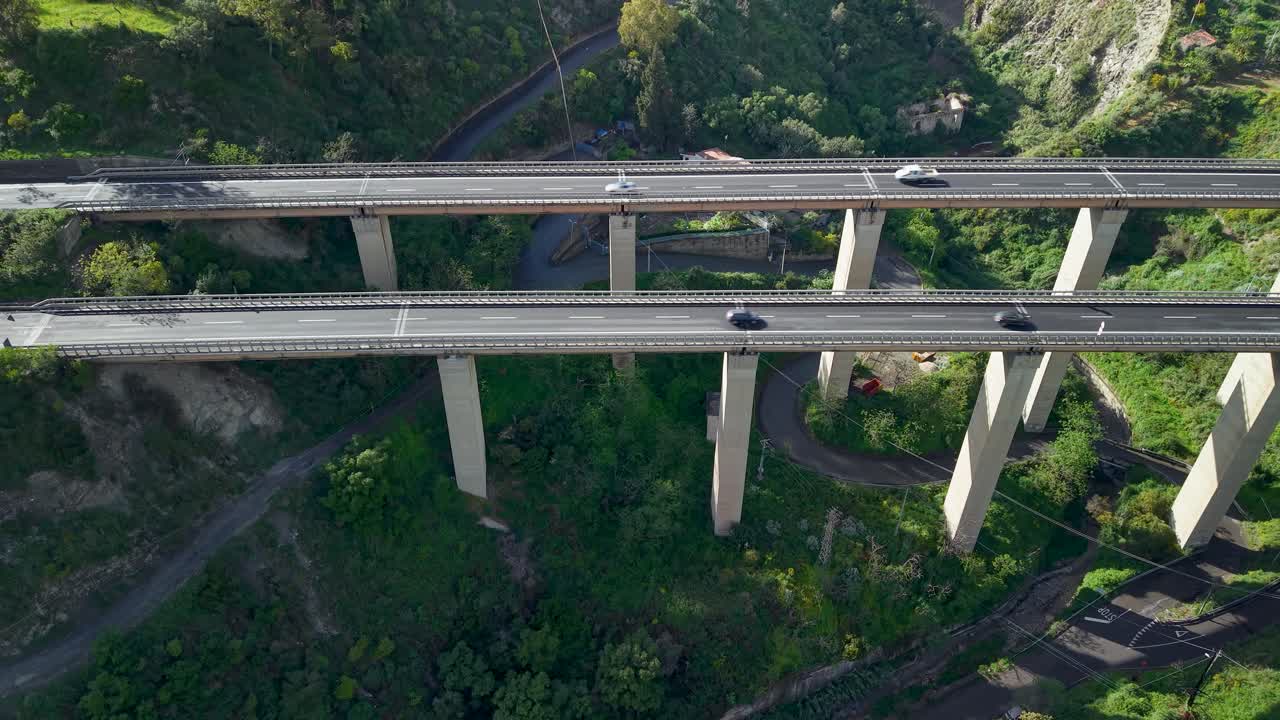 Aerial view of elevated highway in sunny Taormina, Sicily, serene landscape