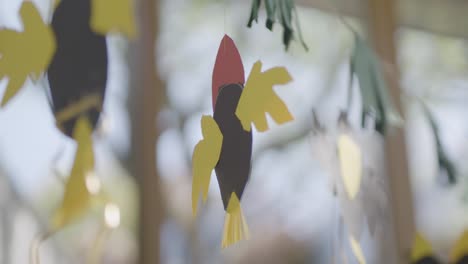 Handcrafted-paper-garland-bird-in-a-kindergarten,-preschool,-close-up