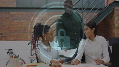 animation of cyber security text, security padlock icon over diverse colleagues discussing at office