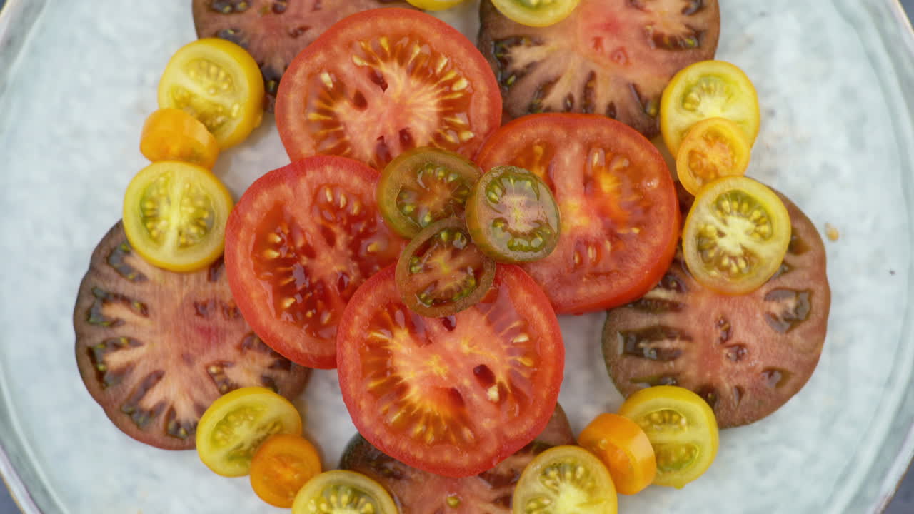 Tomatoes On Plate Rotating From above. Plate Of Healthy Organic Tomatoes, Healthy Vegetarian Vegan Raw Food