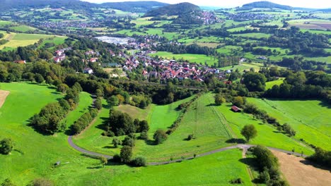 aerial-view-of-rural-village-with-rail-road-tracks-4k